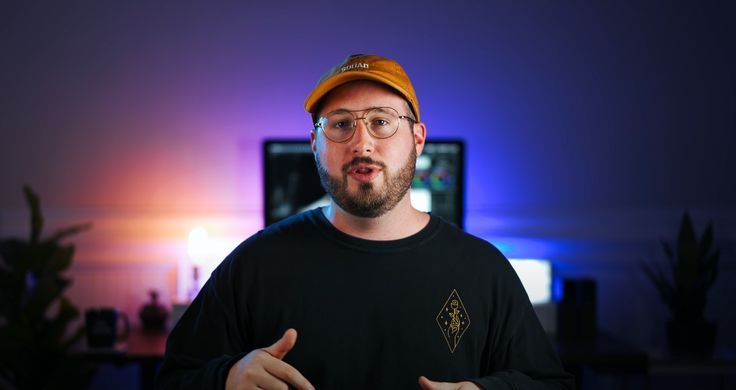 Video creator with beard and cap